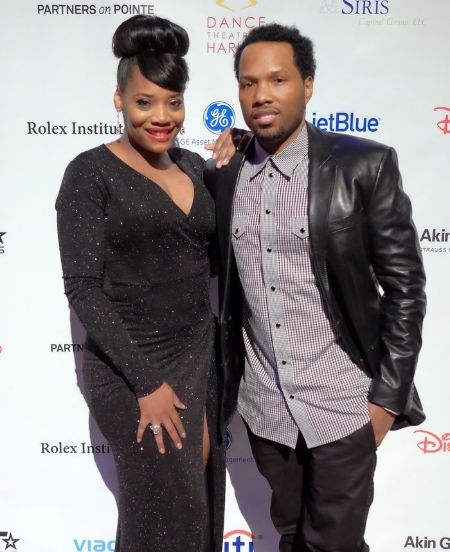 Mendeecees Harris in right poses with his wife Yandy Smith at an event.